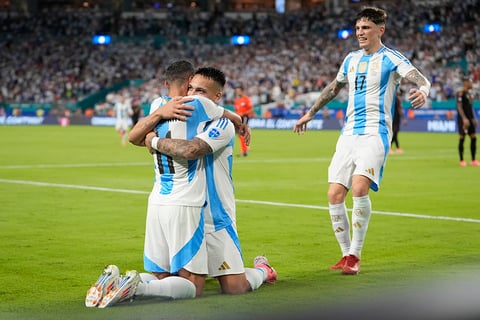 Lautaro Martínez and Angel Di Maria celebrate team's first goal